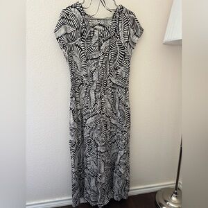 Ankle-length dress with a leafy design in dark brown and white.
